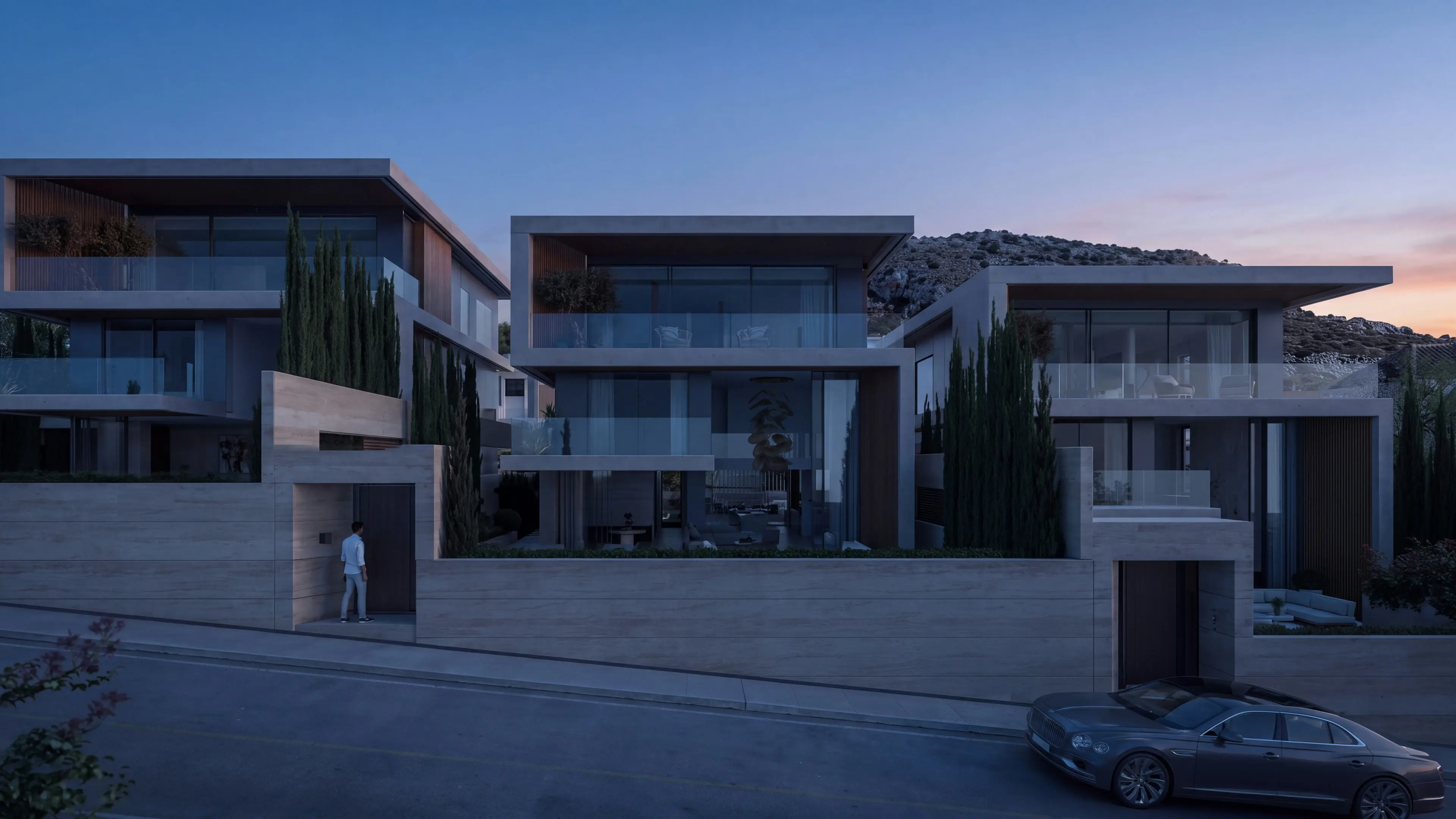 The three Amarè villas on the Vouliagmeni hillside at dawn
